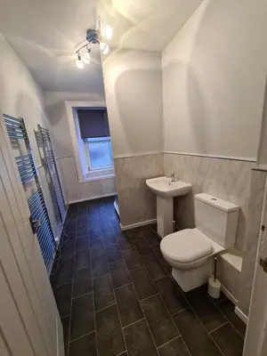a bathroom with a toilet and a sink at Our Salad Days Lochgilphead in Lochgilphead