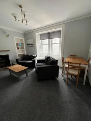a living room with two couches and a table at Our Salad Days Lochgilphead in Lochgilphead