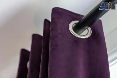 a group of purple napkins sitting next to a wall at 2 Bed Sleeps 4 in Dunfermline in Cairneyhill