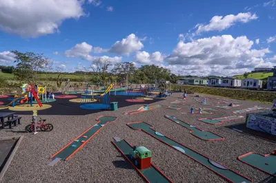 a playground with a bunch of slides and rides at Crofthead Holiday Park in Ayr