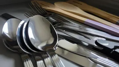 a pile of silver utensils on a table at The Ansi8 in Livingston
