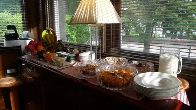 a kitchen counter with bowls and plates of food on it at Sandilands House in Edinburgh
