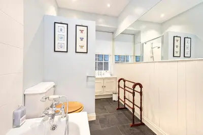 a bathroom with a sink and a toilet at Charming Edinburgh Apartment with 2-Bathroom and Private Entrance in Edinburgh