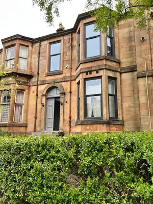an old brick building with windows and a door at The Dixon - Commonwealth Games 2026 in Glasgow