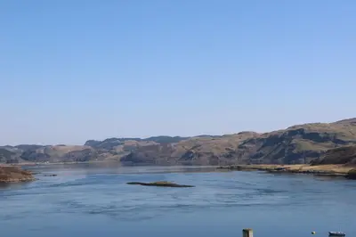 a large body of water with a island in it at Sula in Oban