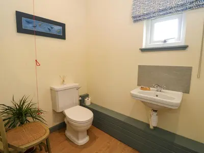 a bathroom with a toilet and a sink at WildLuing in Oban