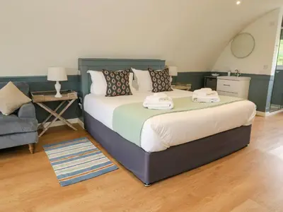 a bedroom with a bed with two towels on it at Erraid in Oban