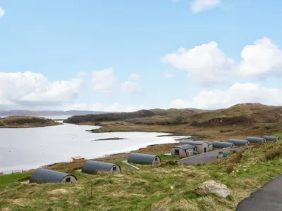 a row of pipes on the side of a river at Insh in Oban