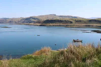 a large body of water with a boat in it at Losal in Oban