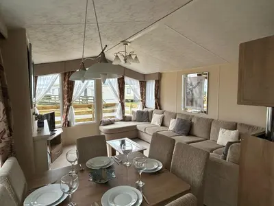 a living room with a couch and a table at New Hampton 36 in Dunoon