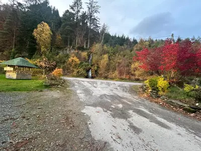 an empty road with a gazebo on the side at New Hampton 36 in Dunoon