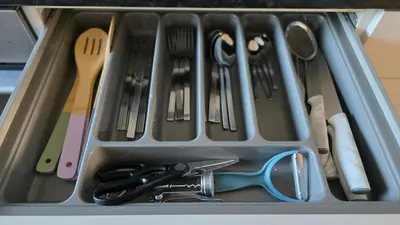 a tray filled with utensils in a drawer at The Ansi9 in Livingston
