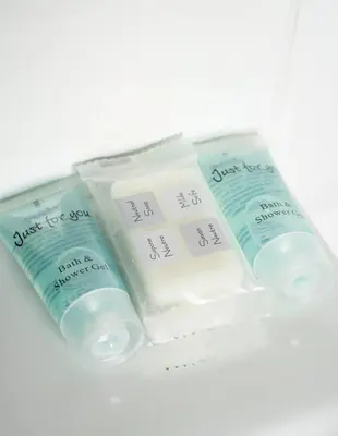 a group of three bottles of soap sitting next to each other at Bartonshill House in Glasgow