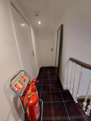 a stairway with a scooter parked in a room at Hotel Room in Maybole for Work Travel & Leisure in Maybole