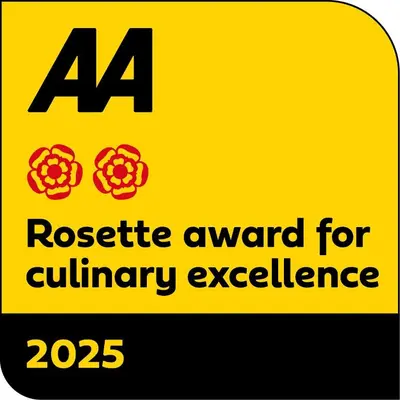 a yellow sign with the words rosette award for military excellence at The Clachan Inn in Dalry