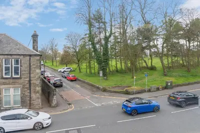 a group of cars parked in a parking lot at Appin House -Cosy 2 bed house in Dunfermline in Dunfermline