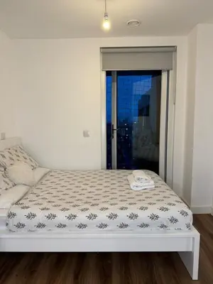 a white bed in a room with a window at Welcome to Home Away From home in Moffat