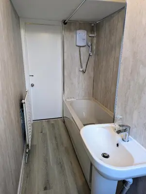 a bathroom with a sink and a bath tub at 2 Bedroom Flat in Edinburgh City in Edinburgh