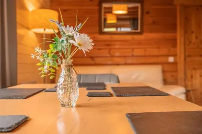 a vase of flowers sitting on top of a table at Lodge 2 in Stirling