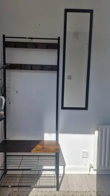 a wooden bench in a room with a bunk bed at My Glasgow House Robroyston in Hogganfield