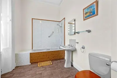 a bathroom with a shower and a toilet and a sink at Rosemount in Campbeltown
