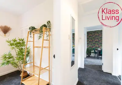 a room with a ladder and a room with a dining room at Sanderson Upper by Klass Living Uddingston in Uddingston