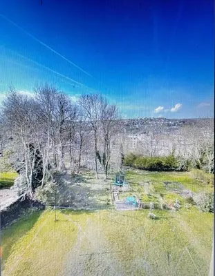 an aerial view of a yard with trees and grass at Isle of Bute Blissful Retreat- Stunning 3 Bed Flat in Rothesay