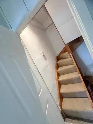 a staircase in a room with a stair case at Galaxy Glasgow 67 in Cardonald