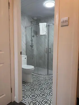 a bathroom with a shower and a toilet at 2-Bed City Apartment by Glasgow Green in Glasgow