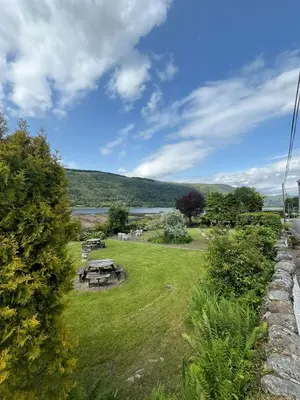 a park with a picnic table in the grass at Cairndow Stagecoach Inn in Cairndow