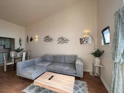 a living room with a couch and a table at Marina 2bedroom Beach Nearby Swansea City in Moffat