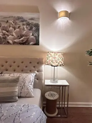 a bedroom with a bed and a lamp on a side table at Marina 2bedroom Beach Nearby Swansea City in Moffat
