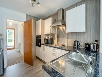 a kitchen with a sink and a counter top at The Mulberry in Lamlash