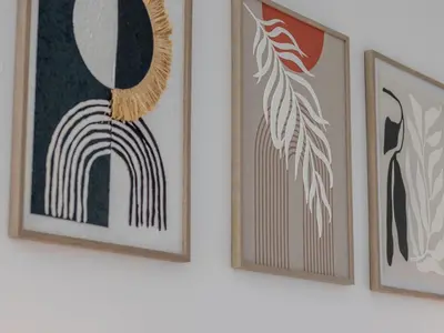 three framed artworks on a wall in a room at Pass the Keys Stay in Glasgow South in Glasgow