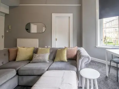 a living room with a couch and a table at Pass the Keys West End Wonder in Glasgow