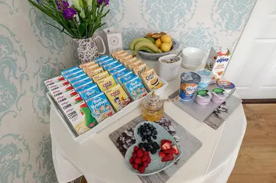 a table with food and fruit on it at Persie Croft Bed & Breakfast in Auchterarder
