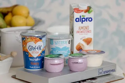 a shelf with yogurt and other food items on it at Persie Croft Bed & Breakfast in Auchterarder