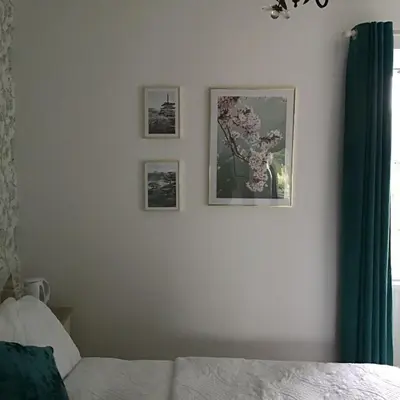 a bedroom with three pictures on the wall at Persie Croft Bed & Breakfast in Auchterarder