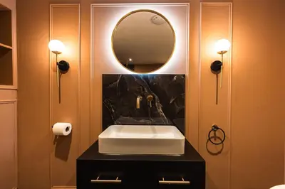 a bathroom with a sink and a mirror at Luxury Georgian Aparthotel by Hauss Ayr - 5mins to Beach, Town Centre! in Ayr