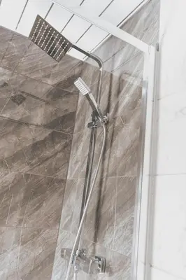 a shower with a glass door in a bathroom at Stylish 3BR Home near Hampden No 264 with Free Parking in Glasgow