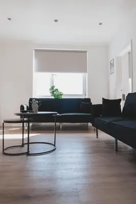 a living room with a couch and a table at Stylish 3BR Stay by Hampden No 161 with Free Parking in Glasgow