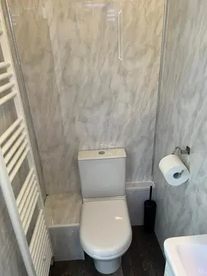 a small bathroom with a toilet and a sink at Truly Central, Princes St, close to Castle in Edinburgh