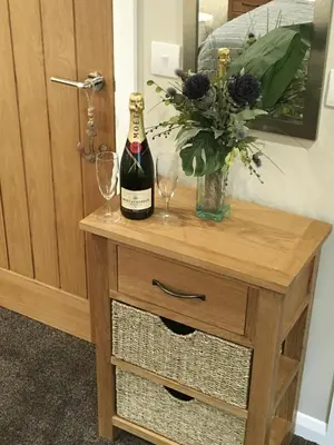 a bottle of champagne and two glasses on a wooden table at The Anchor Inn in Garelochhead