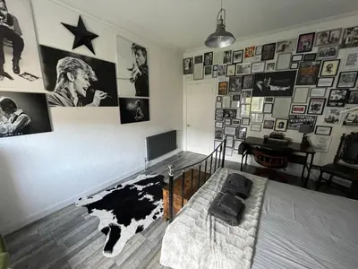 a bedroom with a bed and posters on the wall at Rothesay, Isle of Bute in Rothesay