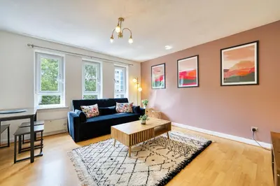 a living room with a couch and a table at 2BR Flat Parking Near City and Finnieston in Glasgow