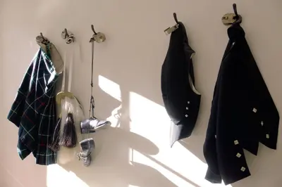 a room with coats hanging on a wall at Grassmarket Old Town Boutique Apartment in Edinburgh