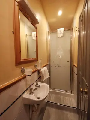 a bathroom with a sink and a shower at Summer's Bay in Rothesay