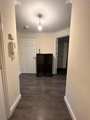 an empty room with a hallway with a door at 2 Bed & 2 Bath-Flat-Driving Distance to Edinburgh in Uphall