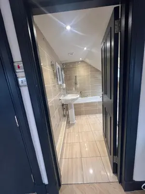 a bathroom with a sink and a tub and a toilet at Fergus in ApartNest Auchterarder in Auchterarder
