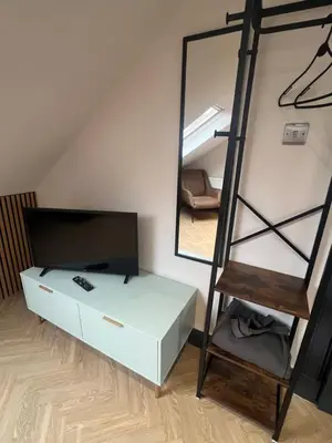 a bedroom with a bunk bed and a mirror at Fergus in ApartNest Auchterarder in Auchterarder